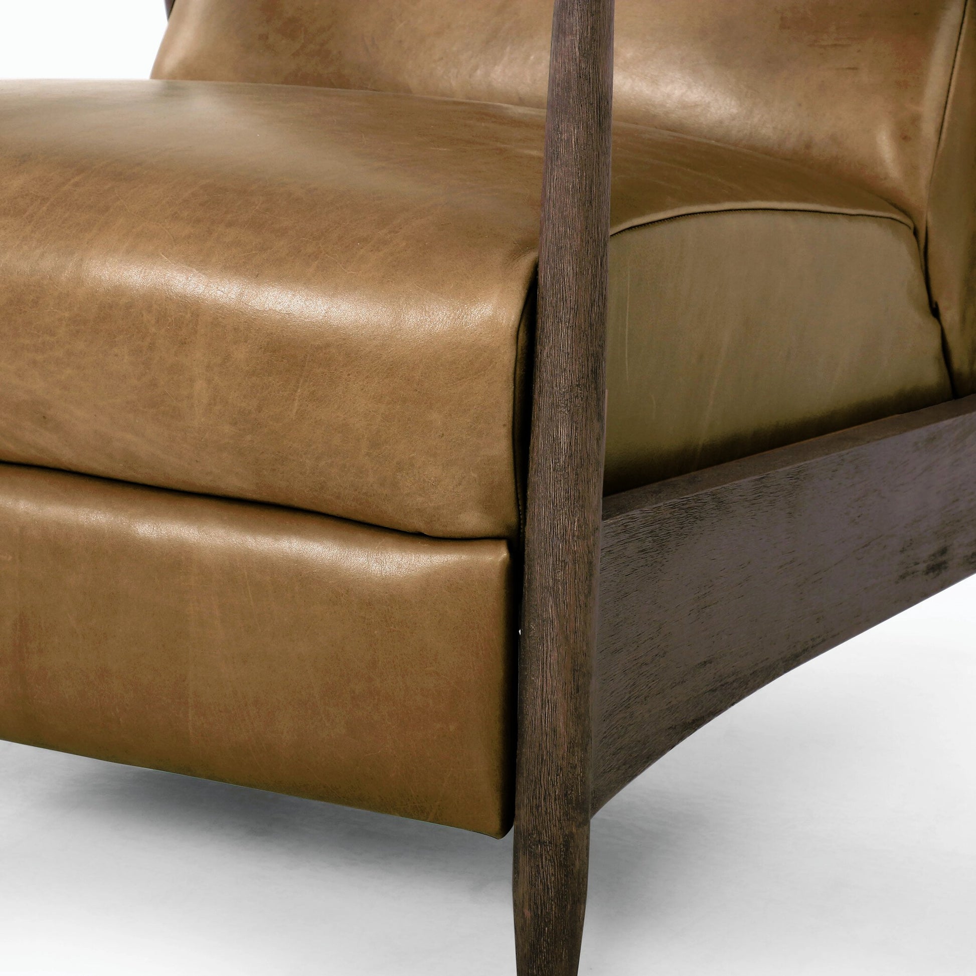 Braden Recliner by Four Hands in dakota black, rubbed sienna brown. Made from top grain leather, solid parawood, 100% polyester in a modern style.