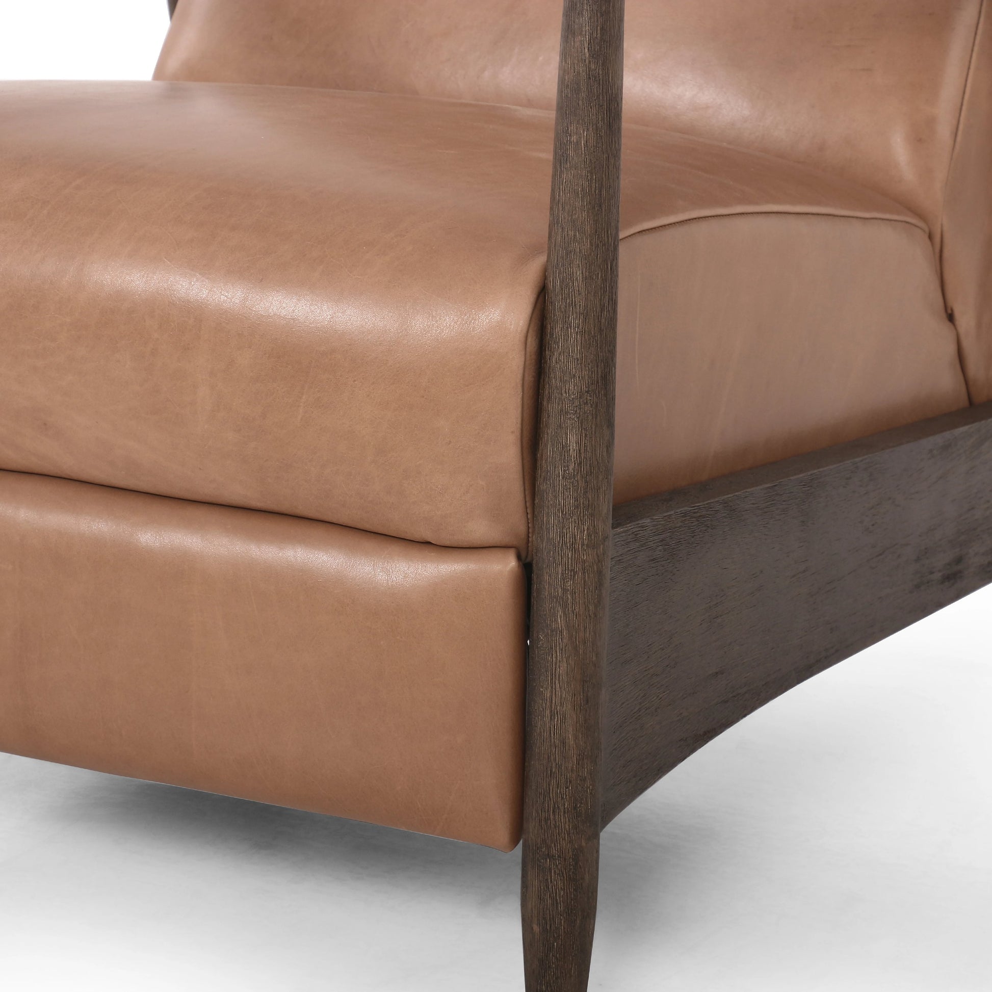 Braden Recliner by Four Hands in dakota black, rubbed sienna brown. Made from top grain leather, solid parawood, 100% polyester in a modern style.