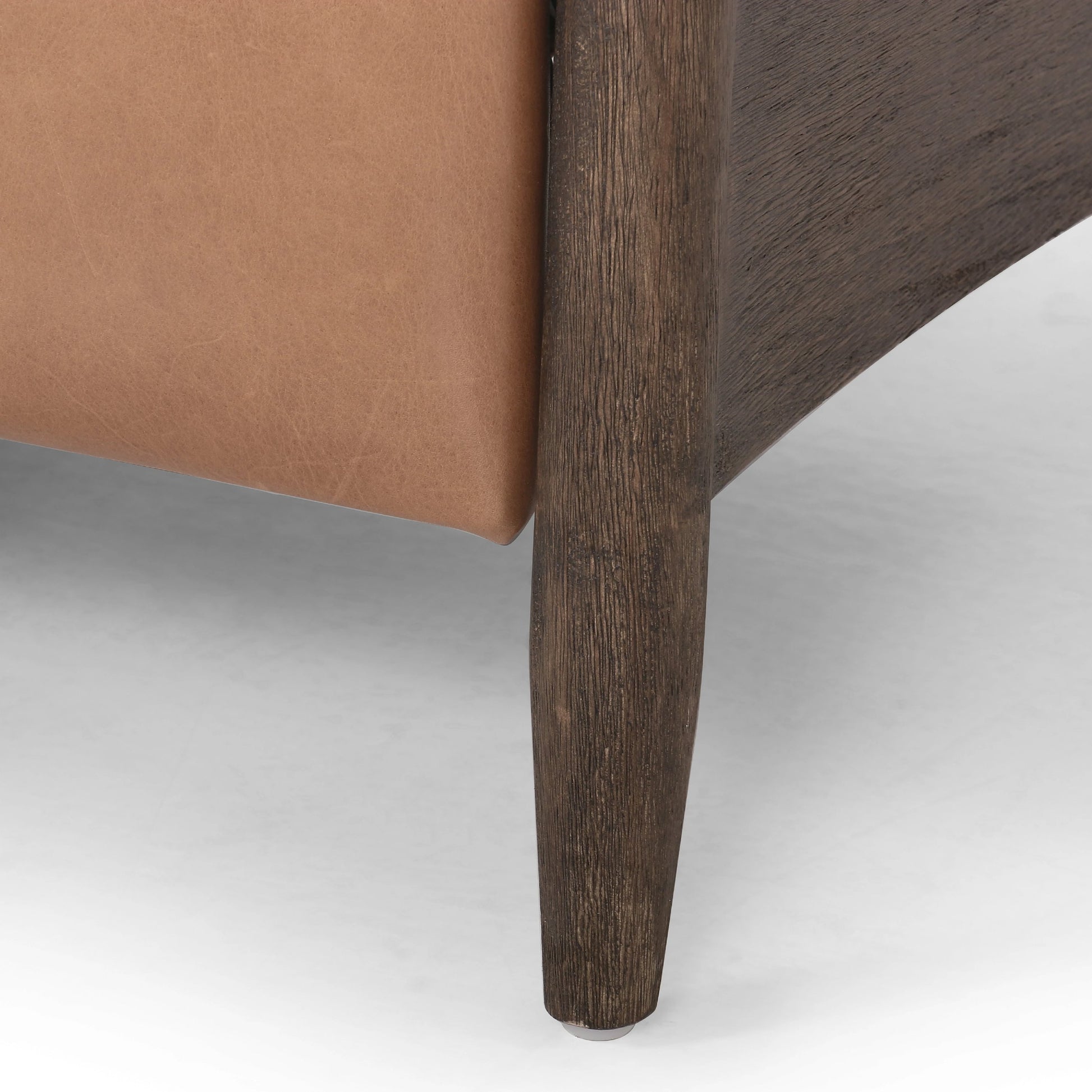Braden Recliner by Four Hands in dakota black, rubbed sienna brown. Made from top grain leather, solid parawood, 100% polyester in a modern style.