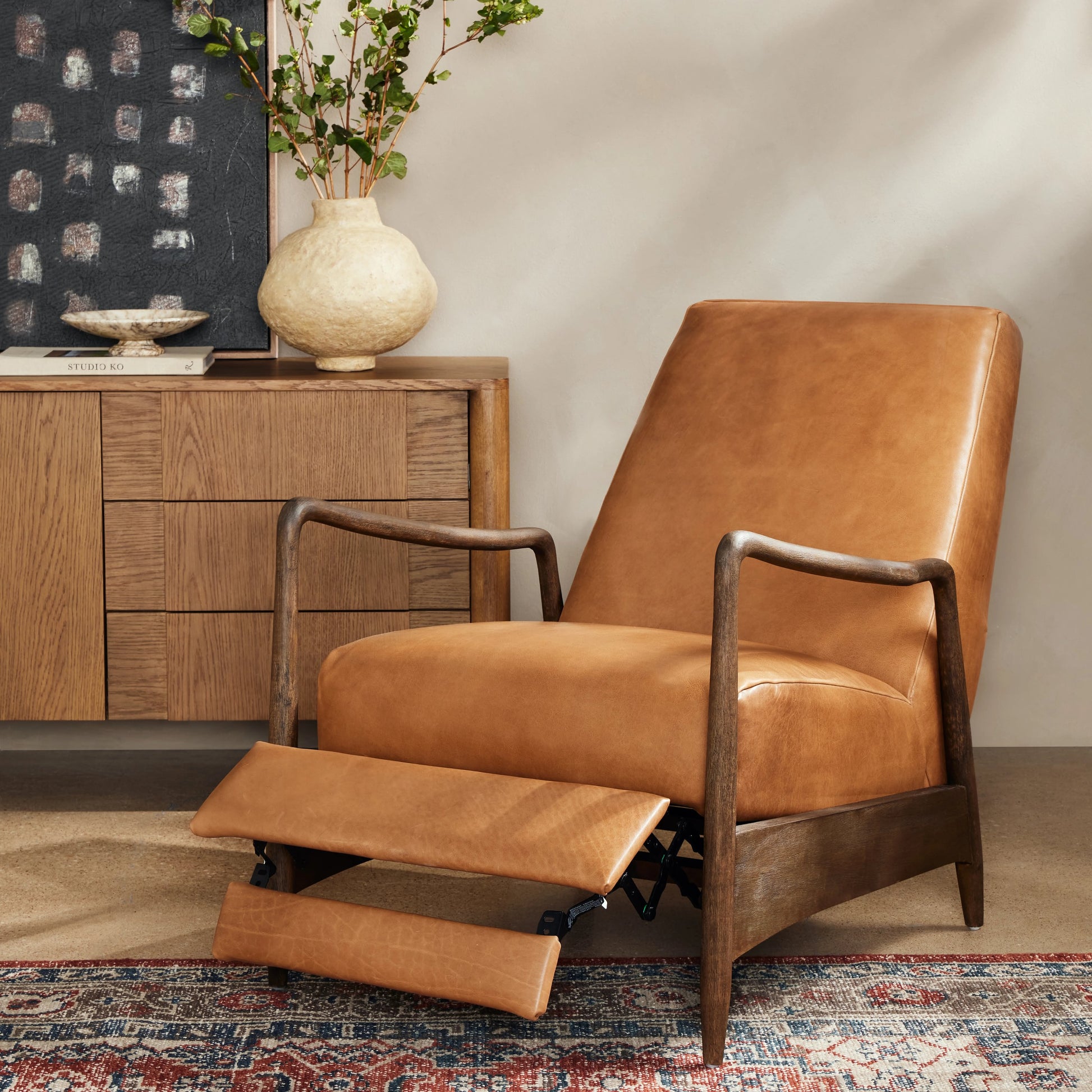 Braden Recliner by Four Hands in dakota black, rubbed sienna brown. Made from top grain leather, solid parawood, 100% polyester in a modern style.