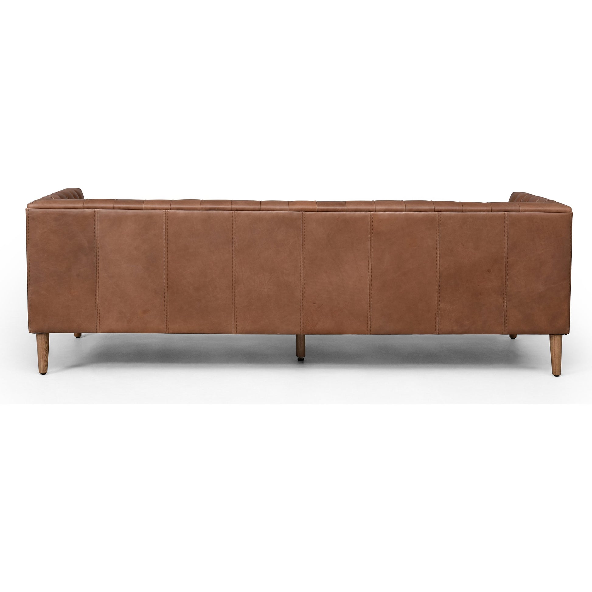 Williams Leather Sofa by Four Hands. Made from top grain leather, solid ash, 100% polyester in a rustic style.