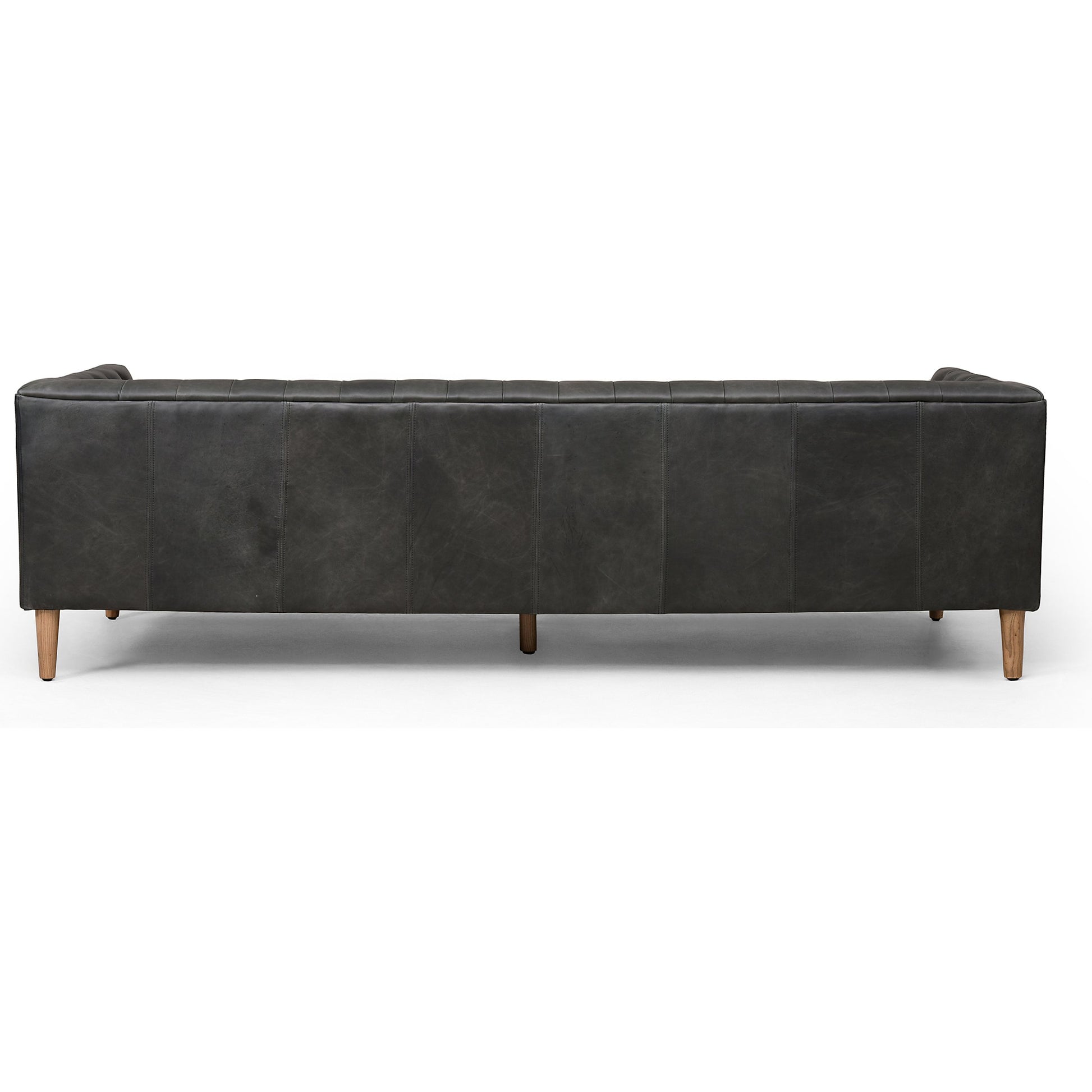 Williams Leather Sofa by Four Hands. Made from top grain leather, solid ash, 100% polyester in a rustic style.