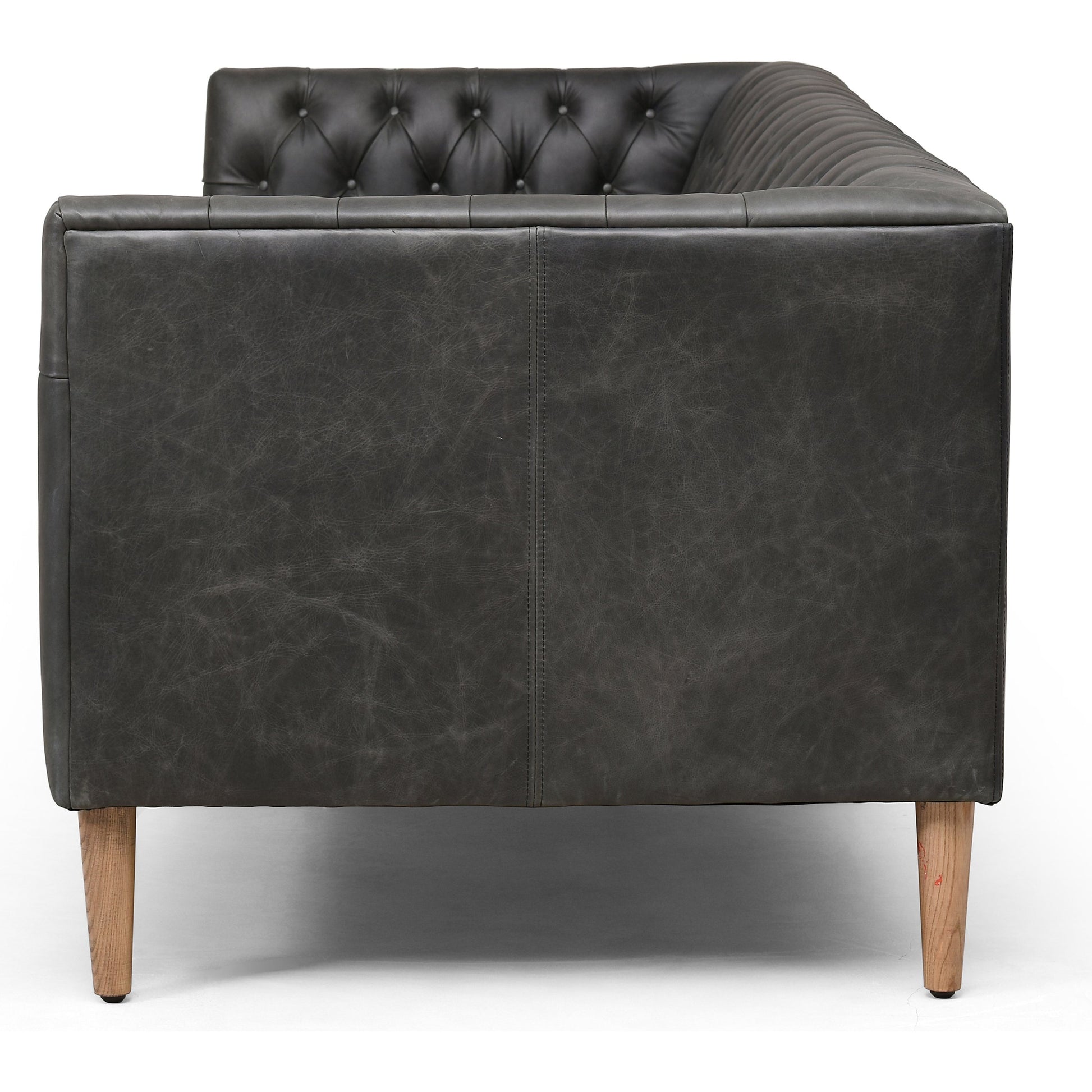 Williams Leather Sofa by Four Hands. Made from top grain leather, solid ash, 100% polyester in a rustic style.