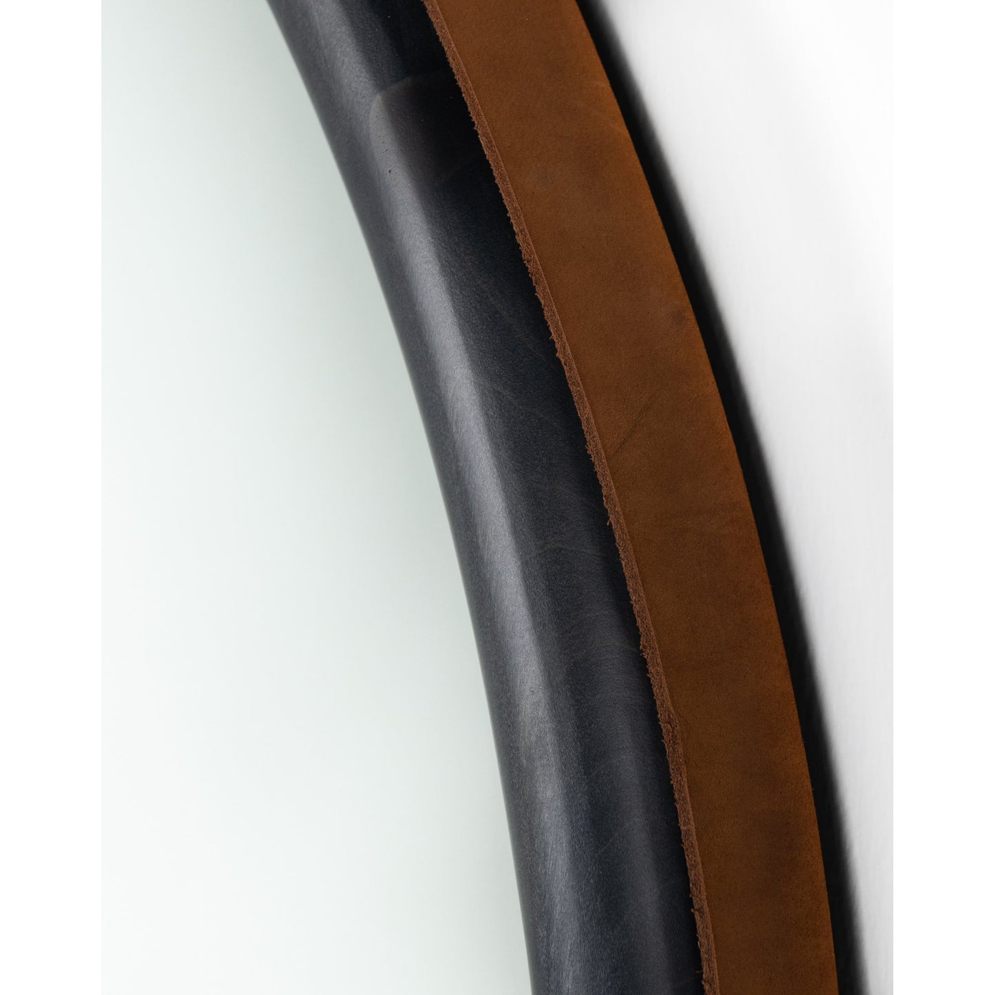 006 SI-1715060 | Closeup | Des Mirror by Four Hands. Made from solid poplar, top grain leather, iron in a modern style.