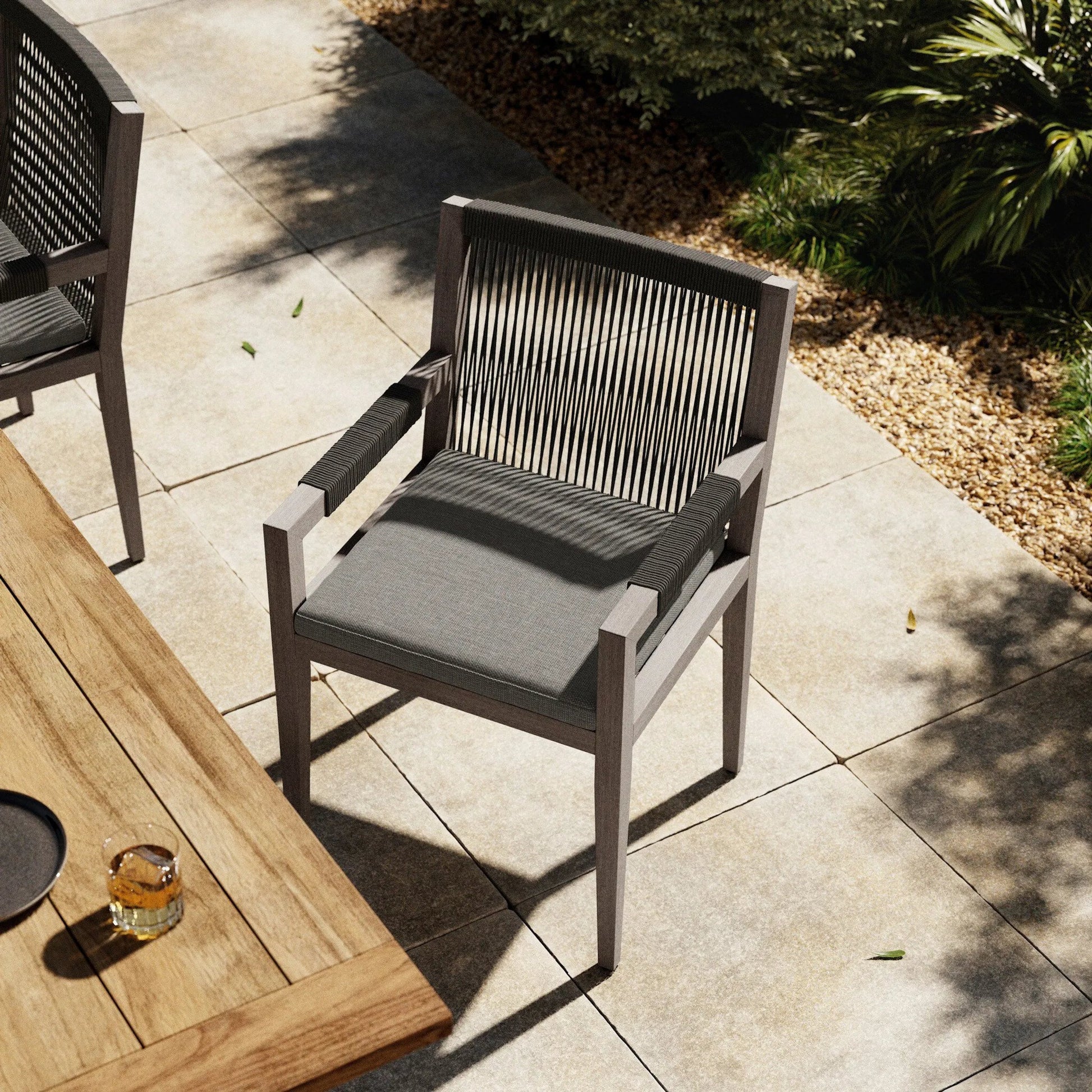 Sherwood Outdoor Dining Armchair, Weathered Grey by Four Hands. Made from 100% olefin, solid fsc®-certified teak, 100% polypropylene in a coastal style.