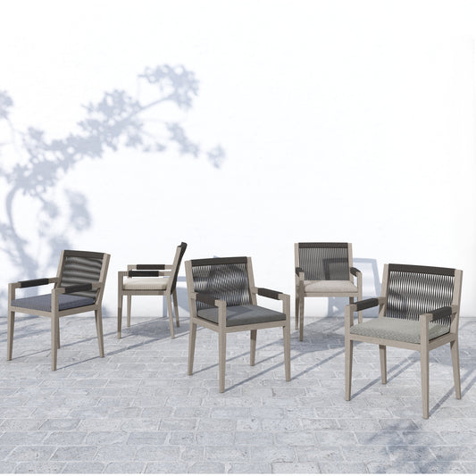 Sherwood Outdoor Dining Armchair, Weathered Grey by Four Hands. Made from 100% olefin, solid fsc®-certified teak, 100% polypropylene in a coastal style.