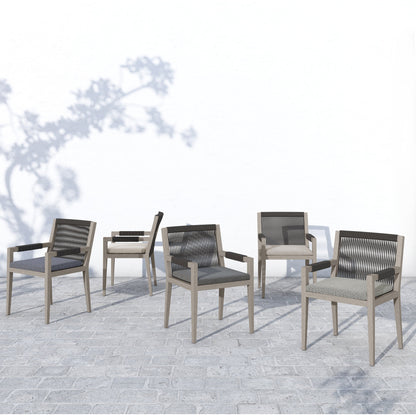 Sherwood Outdoor Dining Armchair, Weathered Grey by Four Hands. Made from 100% olefin, solid fsc®-certified teak, 100% polypropylene in a coastal style.