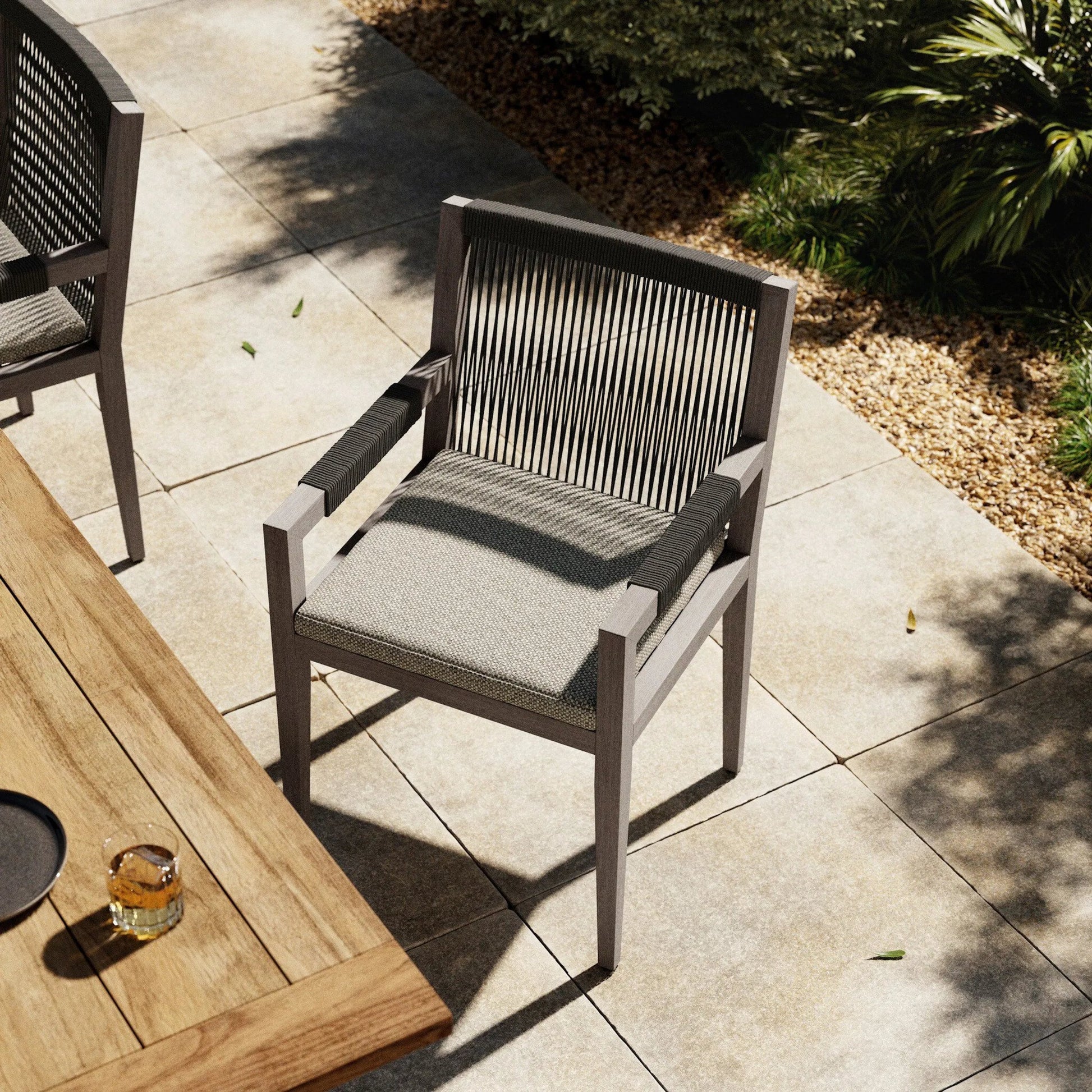 Sherwood Outdoor Dining Armchair, Weathered Grey by Four Hands. Made from 100% olefin, solid fsc®-certified teak, 100% polypropylene in a coastal style.
