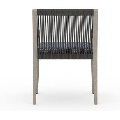 Sherwood Outdoor Dining Armchair, Weathered Grey by Four Hands. Made from 100% olefin, solid fsc®-certified teak, 100% polypropylene in a coastal style.