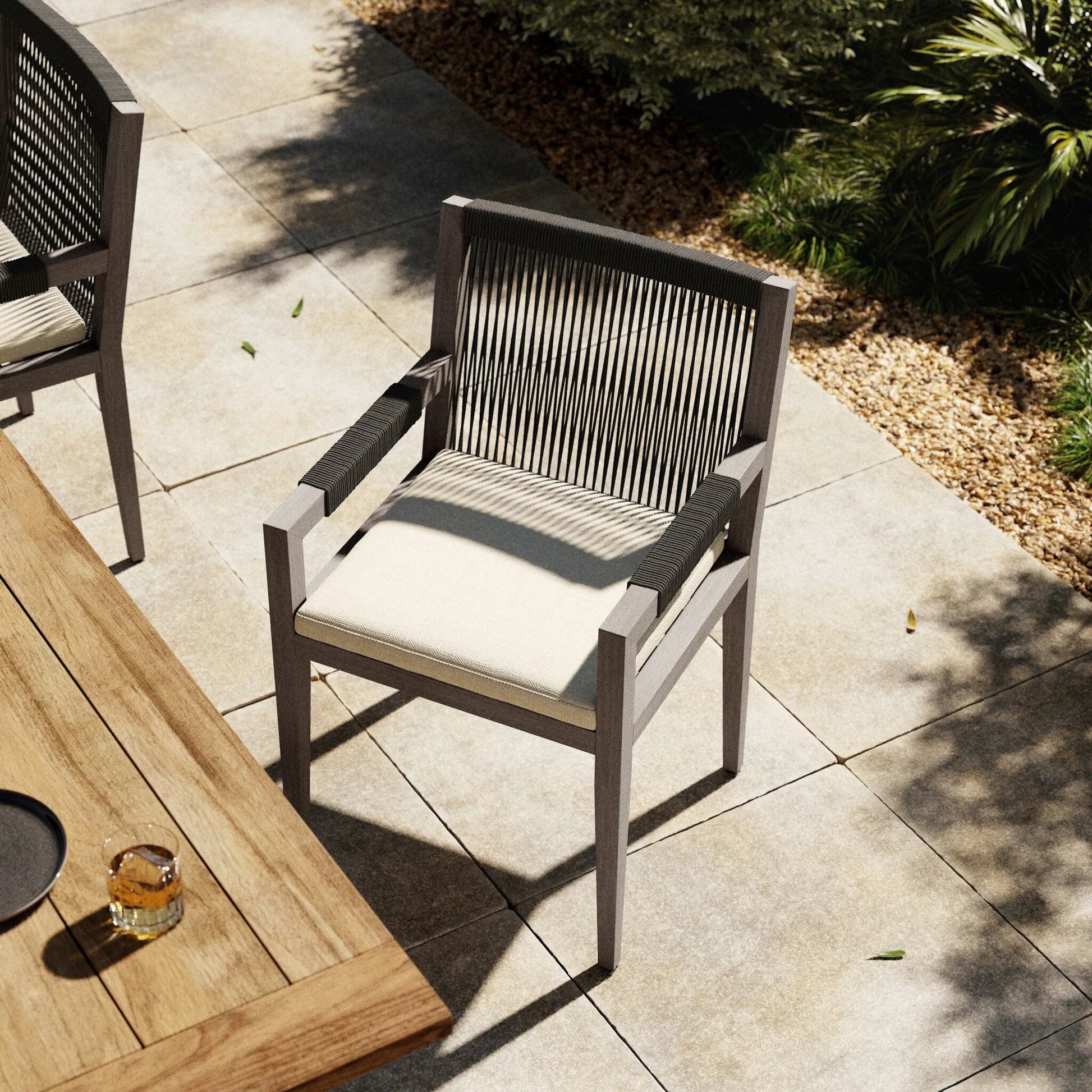 Sherwood Outdoor Dining Armchair, Weathered Grey by Four Hands. Made from 100% olefin, solid fsc®-certified teak, 100% polypropylene in a coastal style.