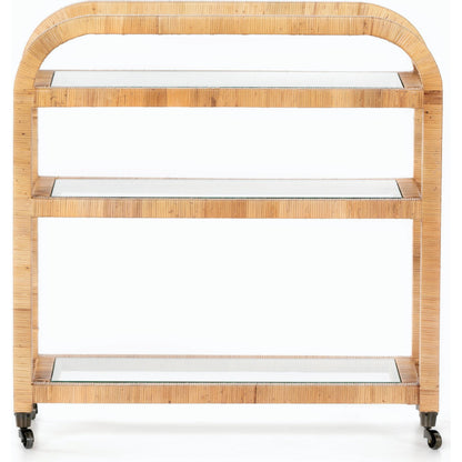 Dory Bar Cart by Four Hands in honey. Made from rattan, tempered glass, solid mahogany in a modern style.