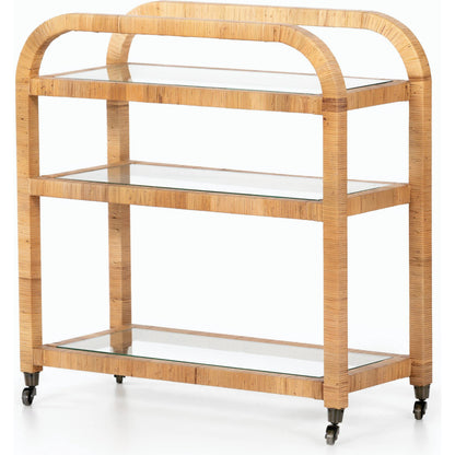 Dory Bar Cart by Four Hands in honey. Made from rattan, tempered glass, solid mahogany in a modern style.