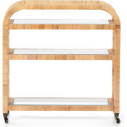 Dory Bar Cart by Four Hands in honey. Made from rattan, tempered glass, solid mahogany in a modern style.