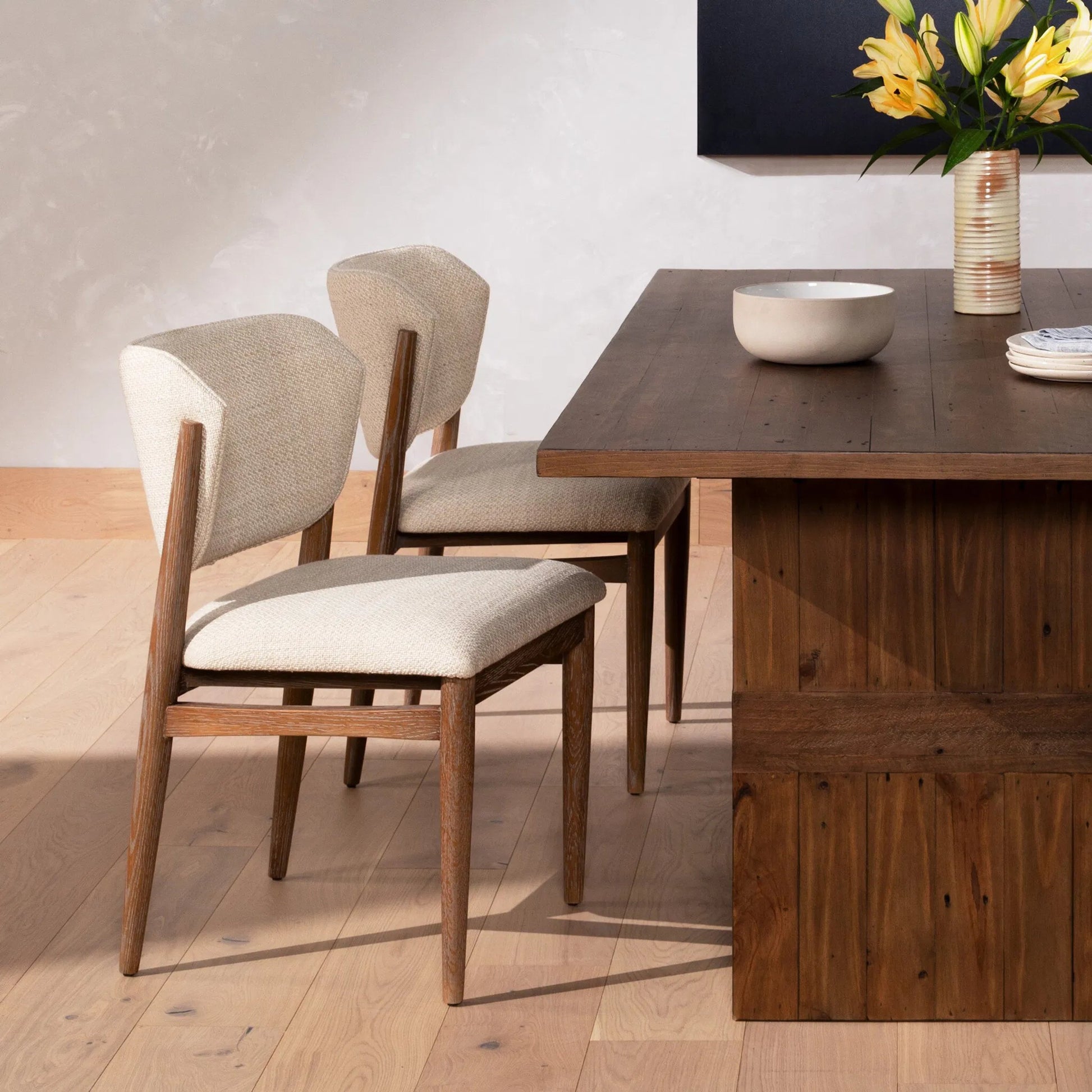 Joren Dining Chair by Four Hands in irving taupe and pecan whitewash. Made from 56% polyester, 44% acrylic, solid nettlewood, 100% polyester in a coastal style.