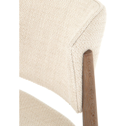 Joren Dining Chair by Four Hands in irving taupe and pecan whitewash. Made from 56% polyester, 44% acrylic, solid nettlewood, 100% polyester in a coastal style.