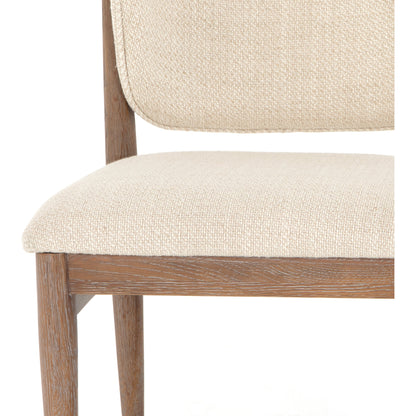 Joren Dining Chair by Four Hands in irving taupe and pecan whitewash. Made from 56% polyester, 44% acrylic, solid nettlewood, 100% polyester in a coastal style.