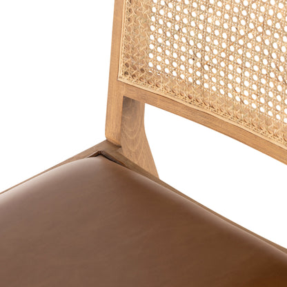 Sage Dining Chair by Four Hands in sierra butterscotch, natural cane, natural beech. Made from faux leather, solid beech, cane in a rustic style.