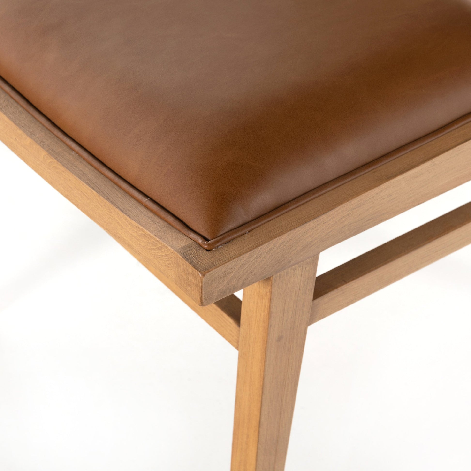 Sage Dining Chair by Four Hands in sierra butterscotch, natural cane, natural beech. Made from faux leather, solid beech, cane in a rustic style.