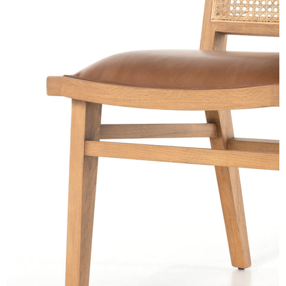 Sage Dining Chair by Four Hands in sierra butterscotch, natural cane, natural beech. Made from faux leather, solid beech, cane in a rustic style.