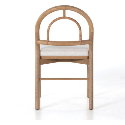 Pace Dining Chair by Four Hands in natural cane, dover crescent and burnished oak. Made from 71% viscose (rayon), 17% polyester, 12% flax, linen, solid oak, cane in a coastal style.