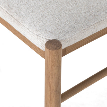 Pace Dining Chair by Four Hands in natural cane, dover crescent and burnished oak. Made from 71% viscose (rayon), 17% polyester, 12% flax, linen, solid oak, cane in a coastal style.