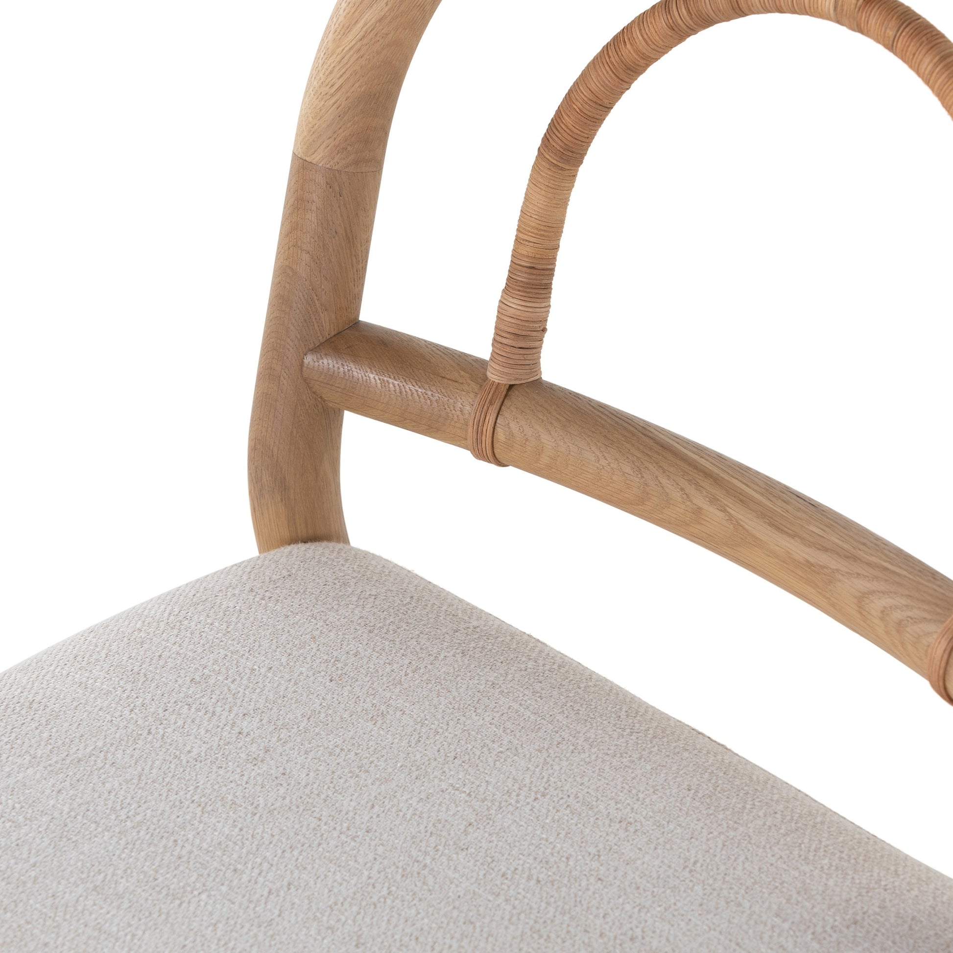 Pace Dining Chair by Four Hands in natural cane, dover crescent and burnished oak. Made from 71% viscose (rayon), 17% polyester, 12% flax, linen, solid oak, cane in a coastal style.