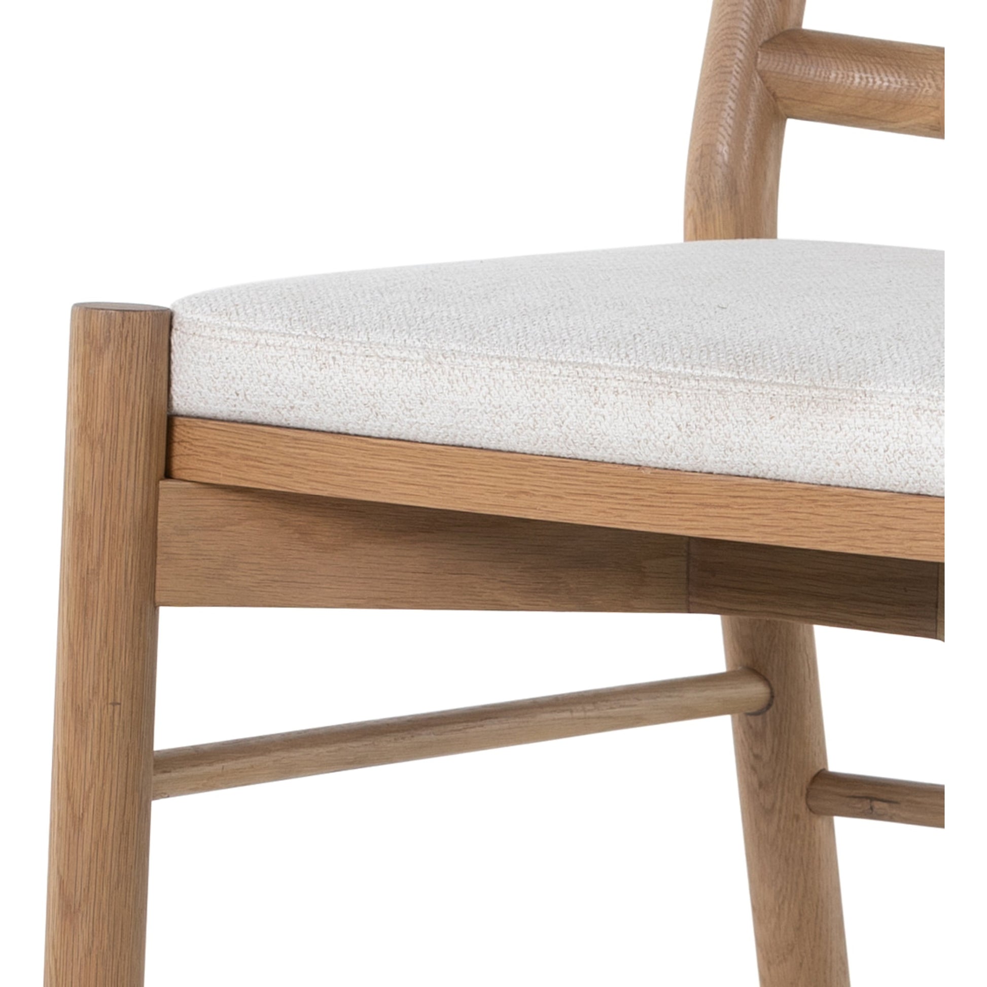 Pace Dining Chair by Four Hands in natural cane, dover crescent and burnished oak. Made from 71% viscose (rayon), 17% polyester, 12% flax, linen, solid oak, cane in a coastal style.