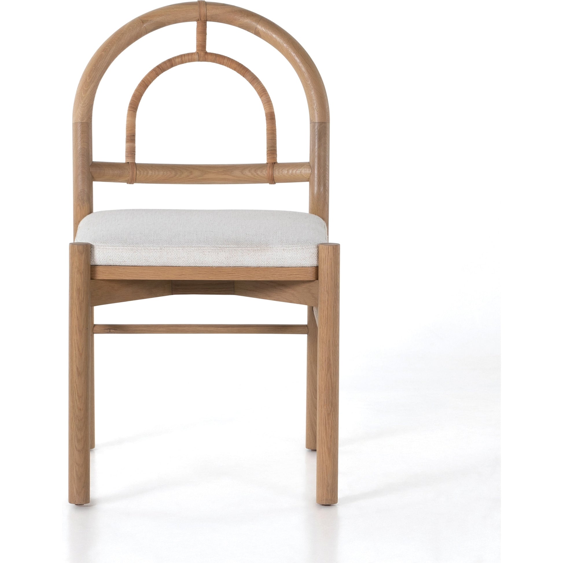 Pace Dining Chair by Four Hands in natural cane, dover crescent and burnished oak. Made from 71% viscose (rayon), 17% polyester, 12% flax, linen, solid oak, cane in a coastal style.