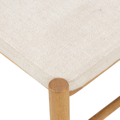Pace Dining Chair by Four Hands in natural cane, dover crescent and burnished oak. Made from 71% viscose (rayon), 17% polyester, 12% flax, linen, solid oak, cane in a coastal style.