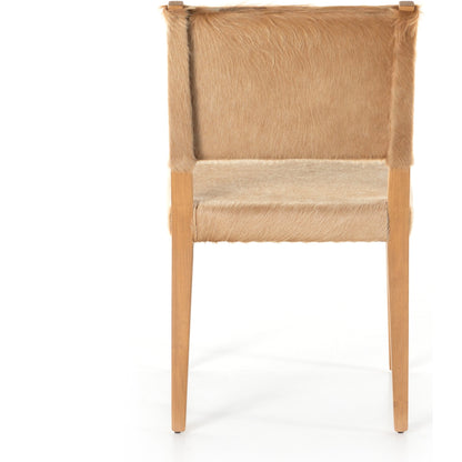 Villa Dining Chair by Four Hands. Made from hair on hide, solid beech, iron in a rustic style.