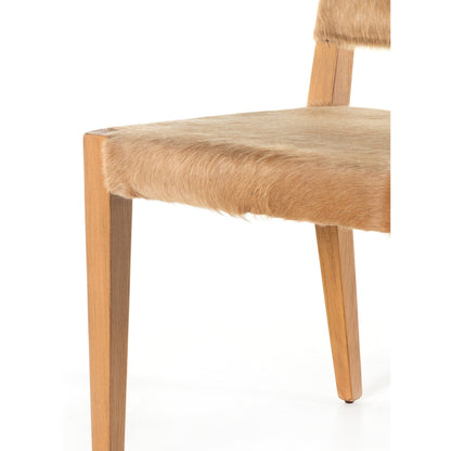 Villa Dining Chair by Four Hands. Made from hair on hide, solid beech, iron in a rustic style.