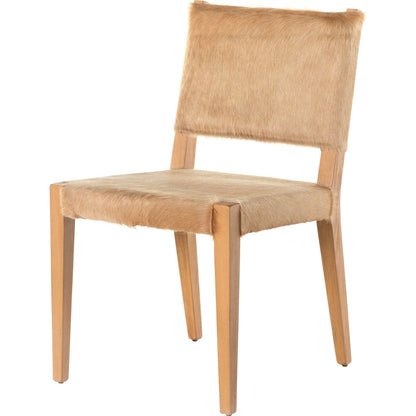 Villa Dining Chair by Four Hands. Made from hair on hide, solid beech, iron in a rustic style.