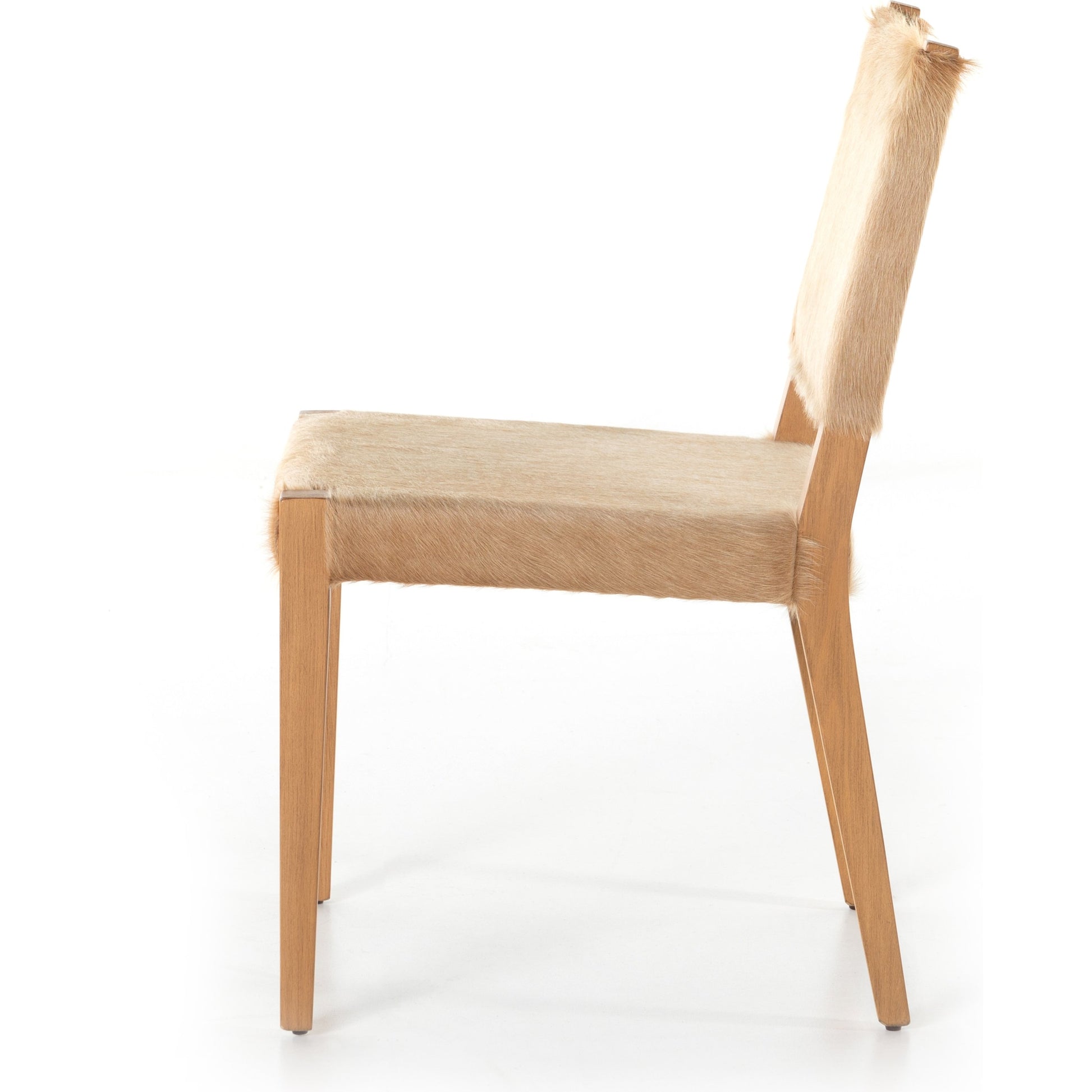 Villa Dining Chair by Four Hands. Made from hair on hide, solid beech, iron in a rustic style.