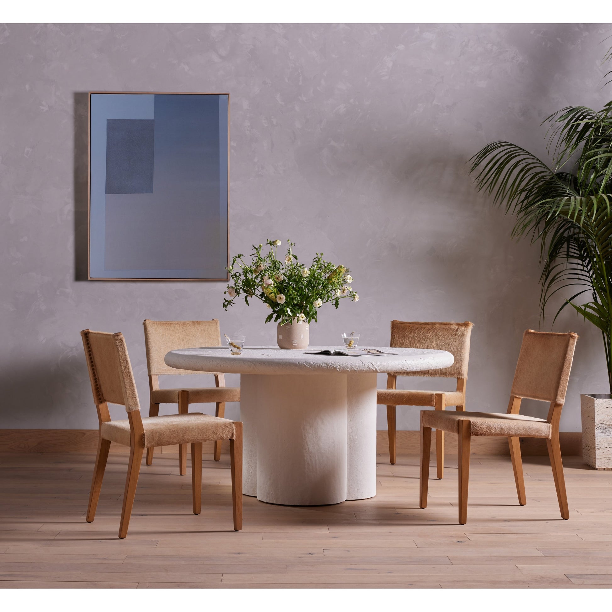 Villa Dining Chair by Four Hands. Made from hair on hide, solid beech, iron in a rustic style.