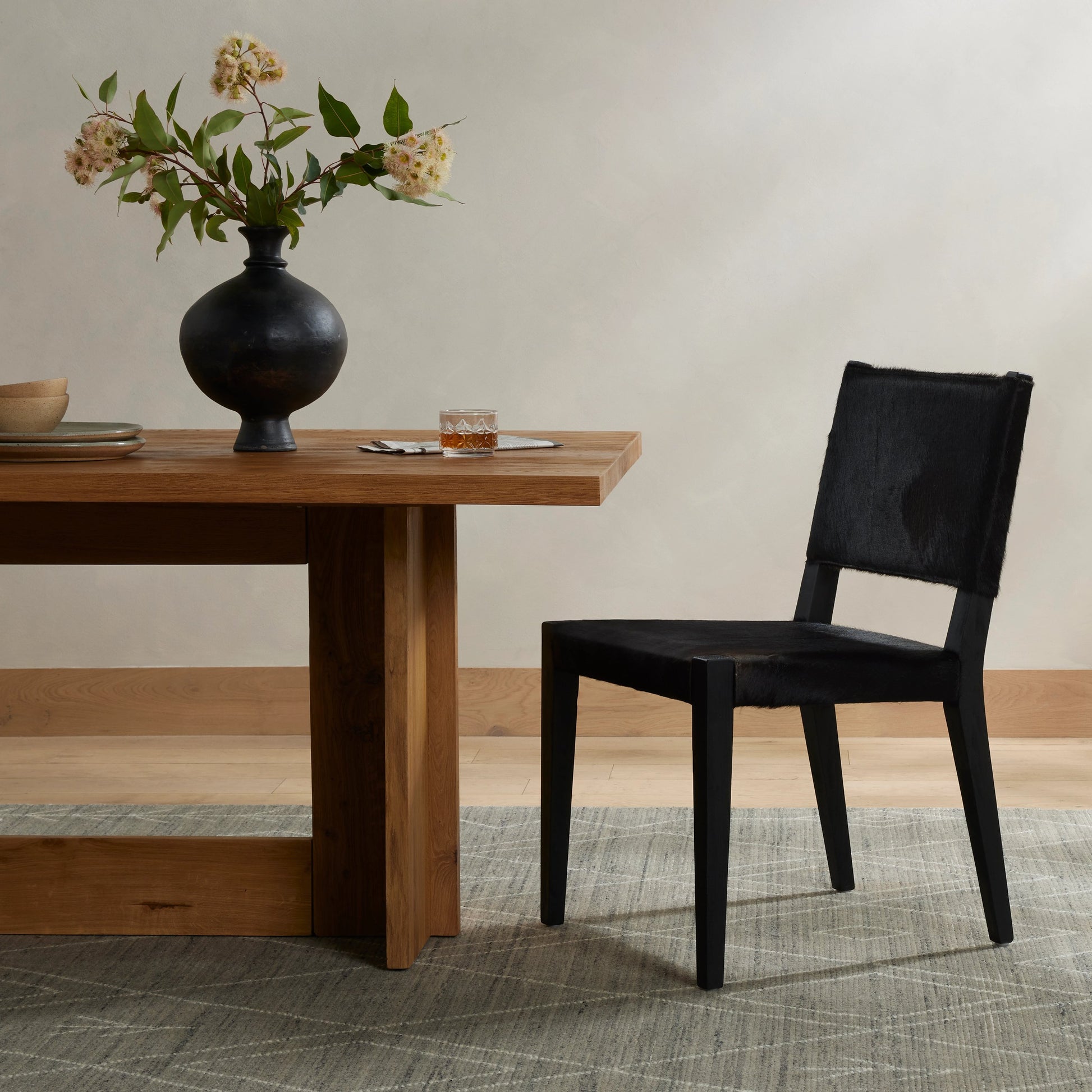 Villa Dining Chair by Four Hands. Made from hair on hide, solid beech, iron in a rustic style.