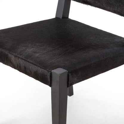 Villa Dining Chair by Four Hands. Made from hair on hide, solid beech, iron in a rustic style.