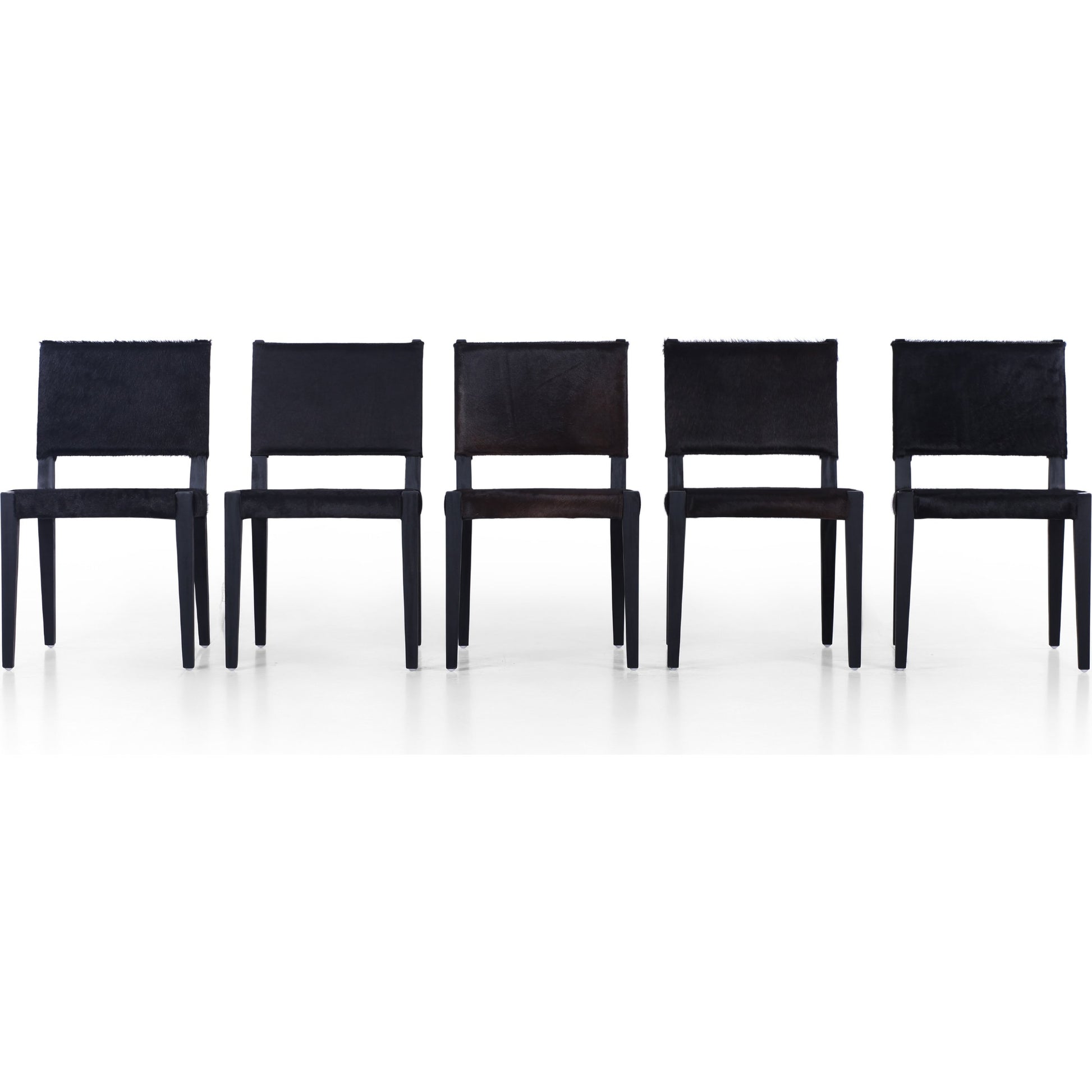 Villa Dining Chair by Four Hands. Made from hair on hide, solid beech, iron in a rustic style.