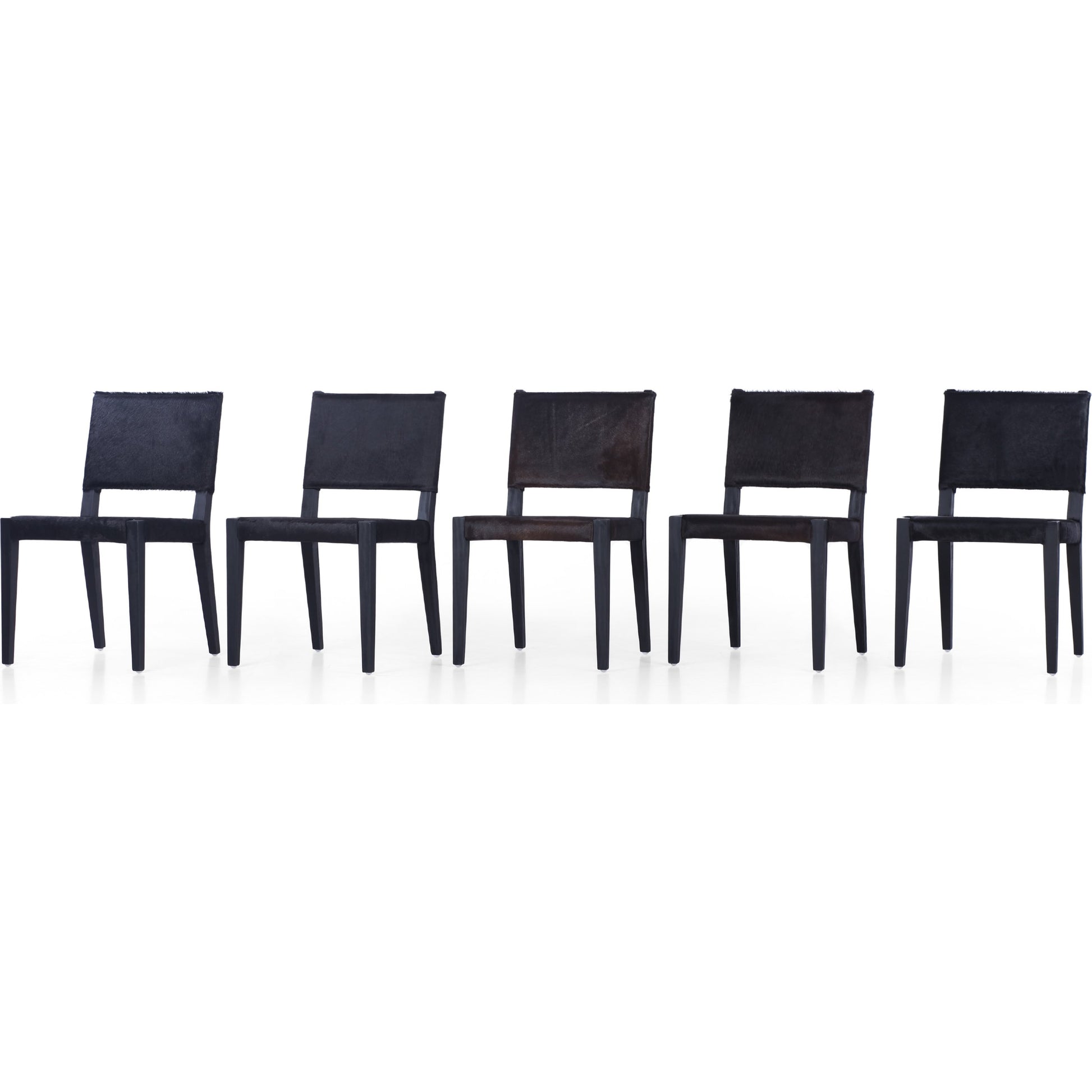 Villa Dining Chair by Four Hands. Made from hair on hide, solid beech, iron in a rustic style.