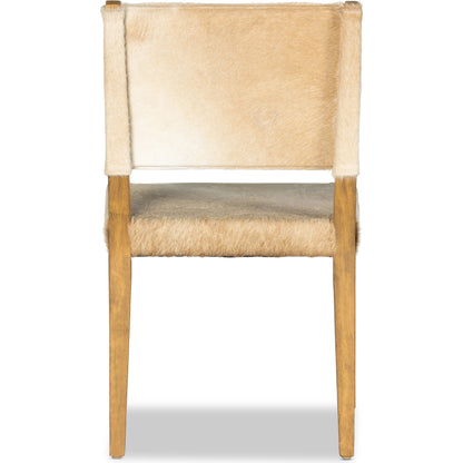 Villa Dining Chair by Four Hands. Made from hair on hide, solid beech, iron in a rustic style.