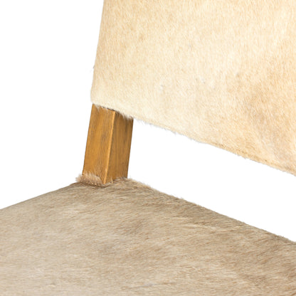 Villa Dining Chair by Four Hands. Made from hair on hide, solid beech, iron in a rustic style.