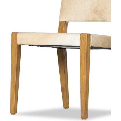 Villa Dining Chair by Four Hands. Made from hair on hide, solid beech, iron in a rustic style.