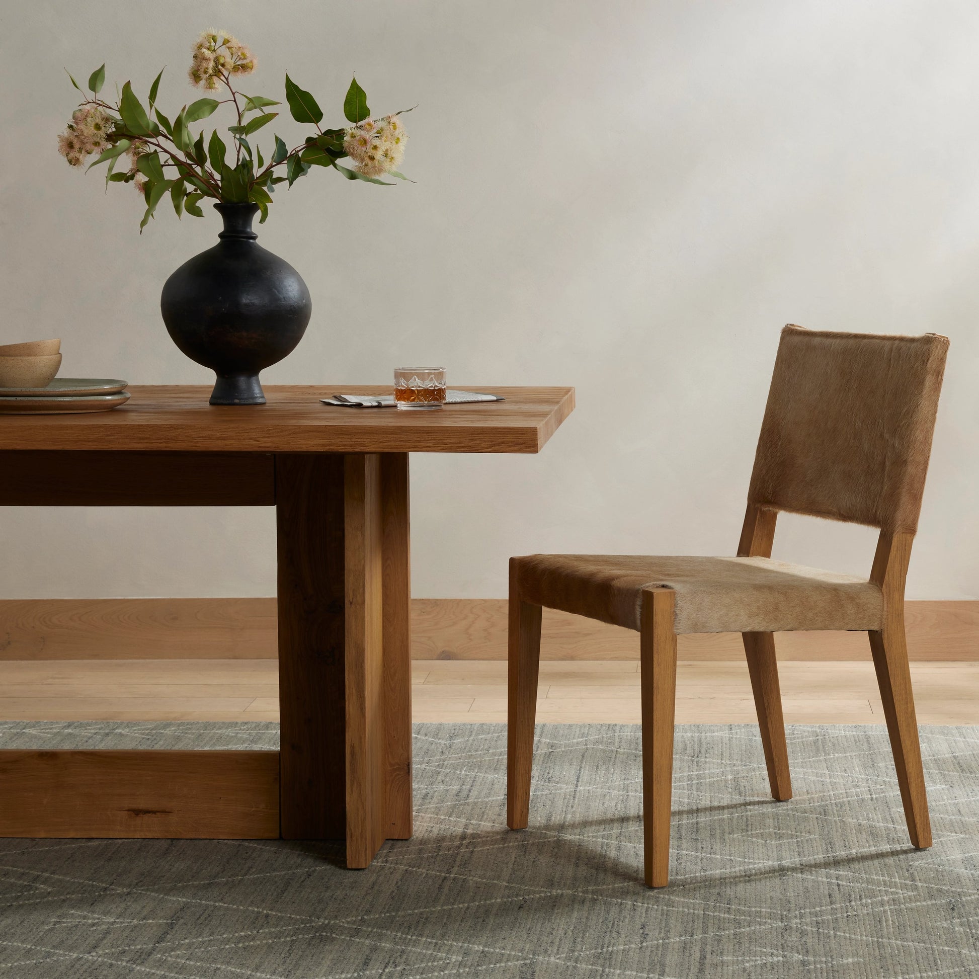Villa Dining Chair by Four Hands. Made from hair on hide, solid beech, iron in a rustic style.