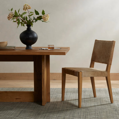 Villa Dining Chair by Four Hands. Made from hair on hide, solid beech, iron in a rustic style.