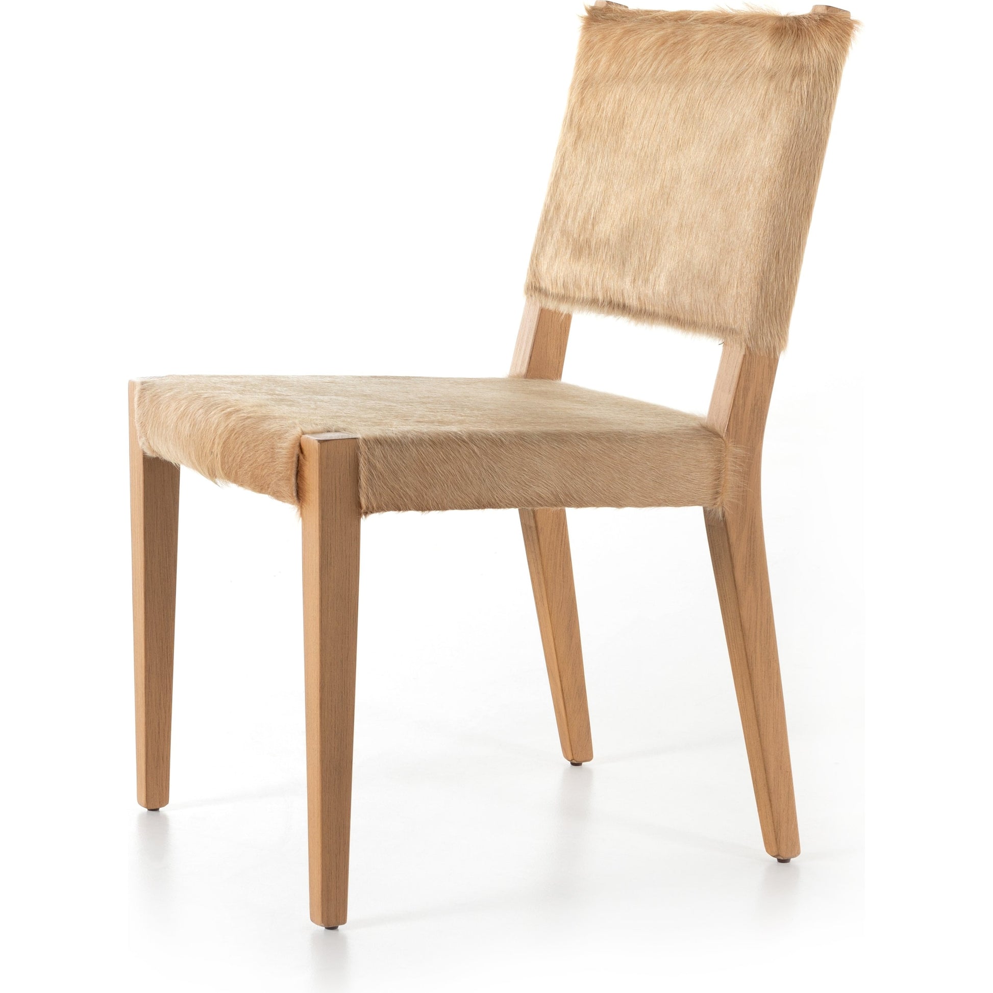 Villa Dining Chair by Four Hands. Made from hair on hide, solid beech, iron in a rustic style.