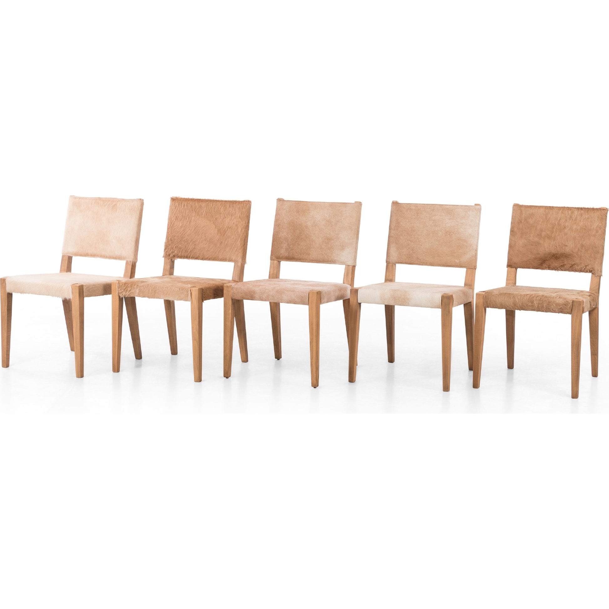 Villa Dining Chair by Four Hands. Made from hair on hide, solid beech, iron in a rustic style.
