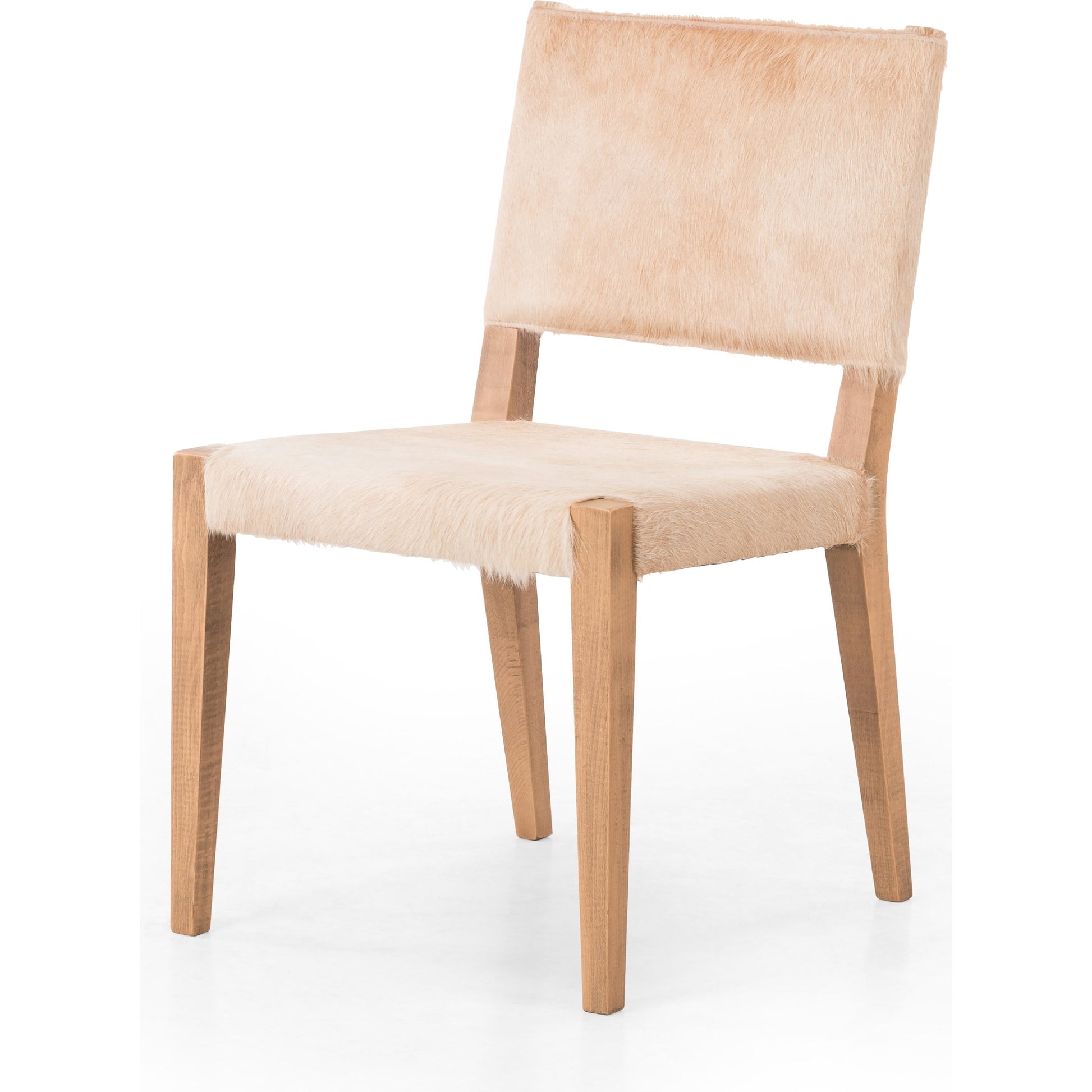 Villa Dining Chair by Four Hands. Made from hair on hide, solid beech, iron in a rustic style.