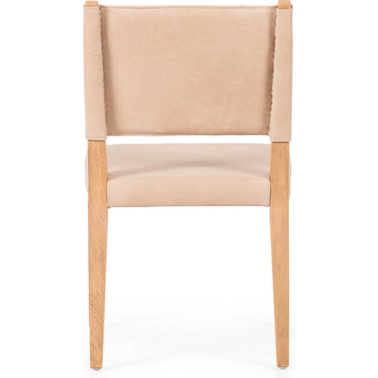 Villa Dining Chair by Four Hands. Made from hair on hide, solid beech, iron in a rustic style.
