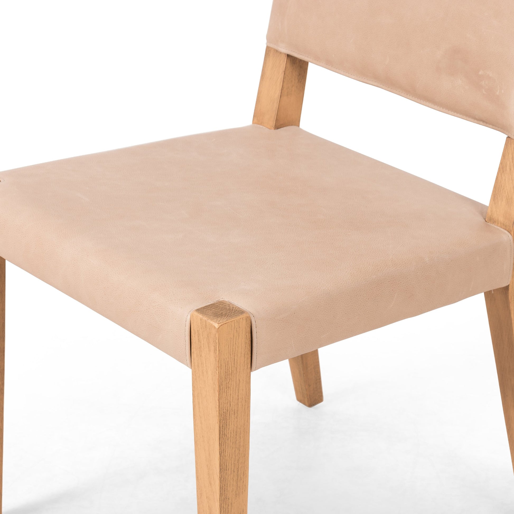 Villa Dining Chair by Four Hands. Made from hair on hide, solid beech, iron in a rustic style.