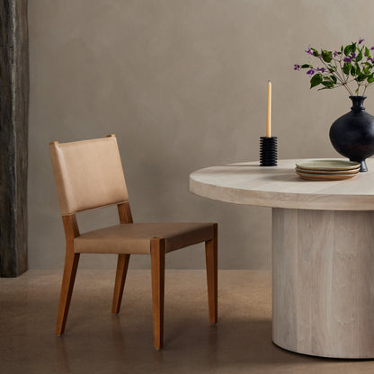 Villa Dining Chair by Four Hands. Made from hair on hide, solid beech, iron in a rustic style.