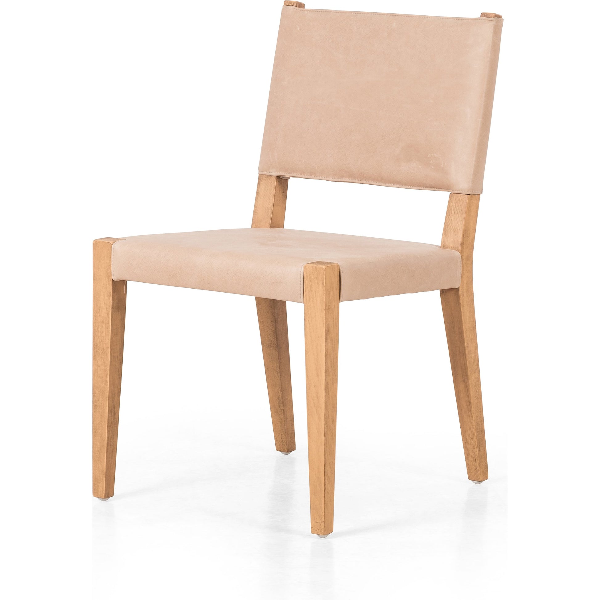 Villa Dining Chair by Four Hands. Made from hair on hide, solid beech, iron in a rustic style.